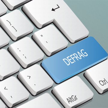 computer defrag blue key on white keyboard